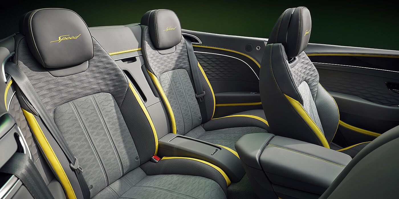 Bentley Perth Bentley New Continental GTC Speed convertible rear interior with unique Speed colour split in Gravity Grey and Cyber Yellow hide colours, and contrast stitched headrest emblems 