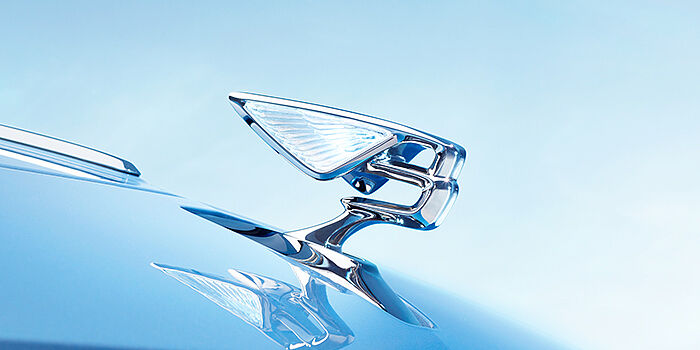 Bentley Perth Bentley Flying Spur Azure sedan bonnet close up in Light Windsor Blue paint with Illuminated Flying B mascot