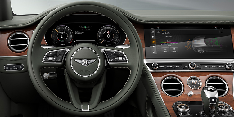 Bentley Perth New Bentley Continental GT coupe steering wheel and front cabin view in Cumbrian Green hide and Crown Cut walnut veneer